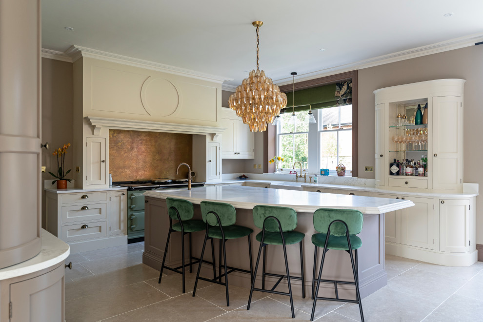 Design ideas for a large traditional l-shaped kitchen/diner in Oxfordshire with a submerged sink, shaker cabinets, beige cabinets, quartz worktops, brown splashback, ceramic flooring, an island, beige floors, white worktops and feature lighting.