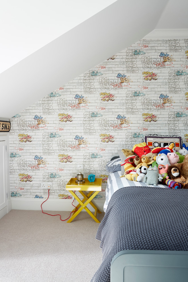 Photo of a contemporary kids' bedroom for kids 4-10 years old and boys in London with multi-coloured walls and carpet.
