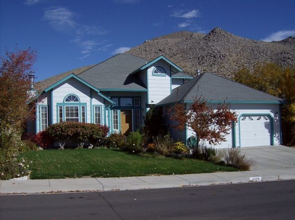 Example of a mid-sized white two-story wood exterior home design