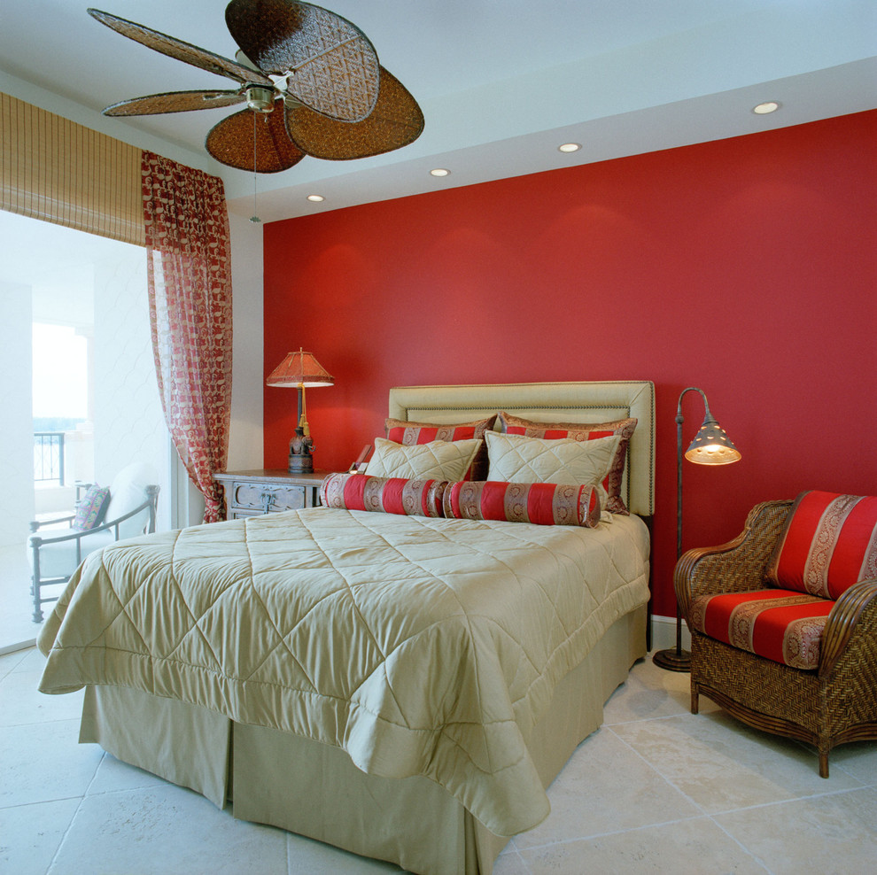 Photo of a tropical bedroom in Miami with red walls.