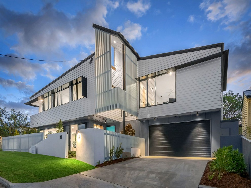 Design ideas for a contemporary two-storey white house exterior in Brisbane.