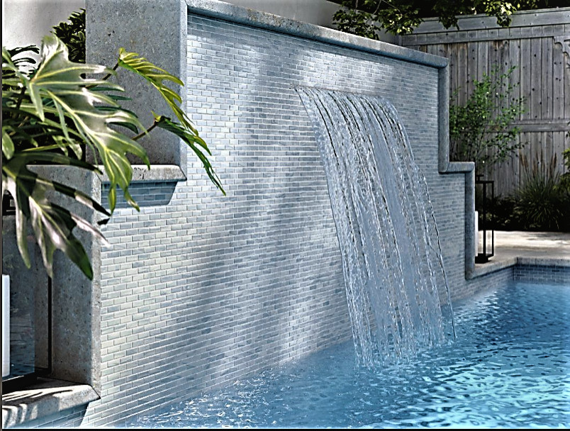 Example of a beach style backyard pool design in Vancouver