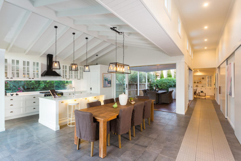 Large contemporary kitchen/dining combo in Brisbane with white walls, travertine floors, no fireplace and grey floor.