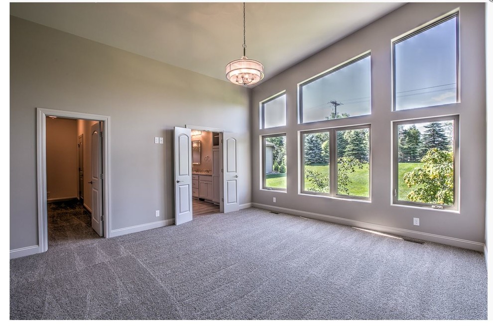 Example of a transitional home design design in Omaha