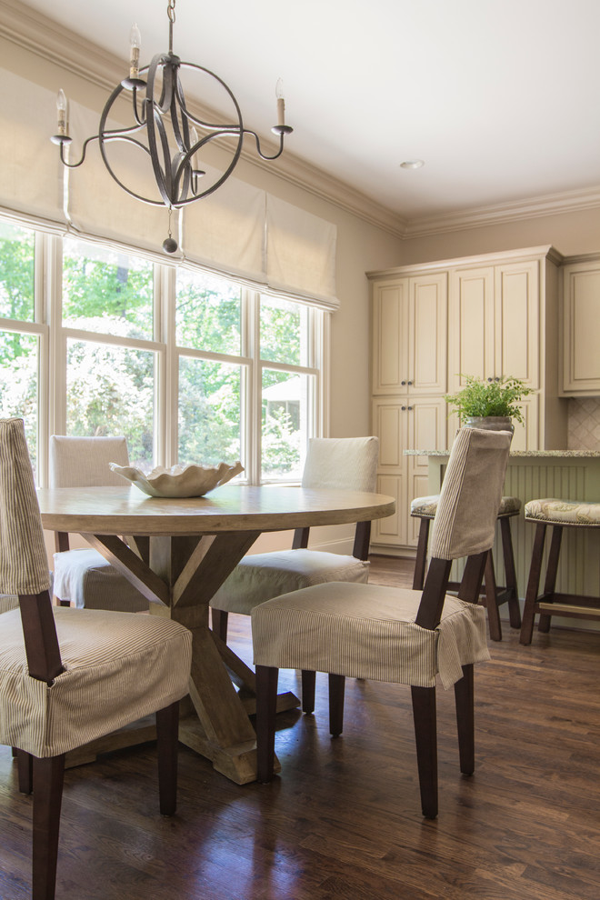 Photo of a transitional eat-in kitchen in Birmingham with with island.