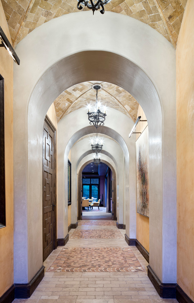Design ideas for an expansive mediterranean hallway in Houston with white walls.