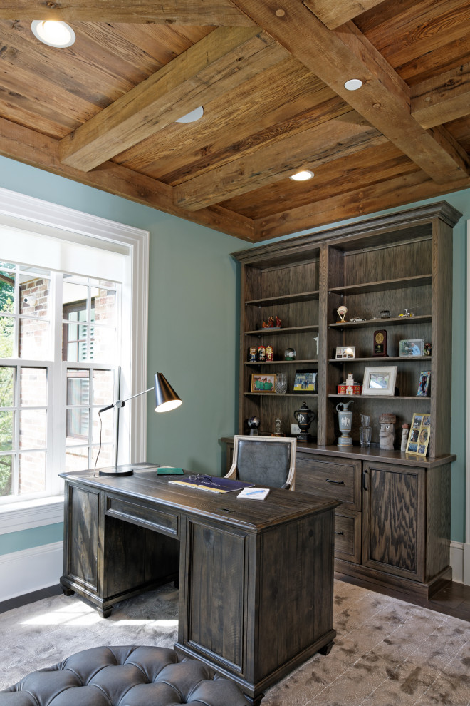 Inspiration for a mid-sized traditional home office in DC Metro with a freestanding desk, wood, green walls, no fireplace, brown floor and dark hardwood floors.
