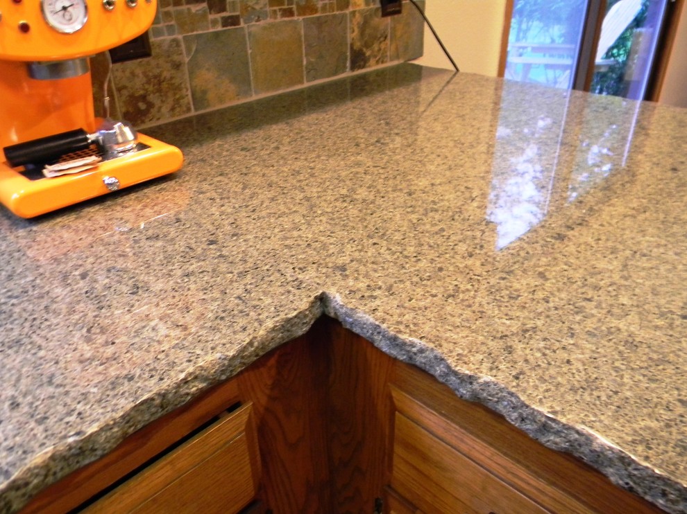 Example of a kitchen design in Seattle with granite countertops