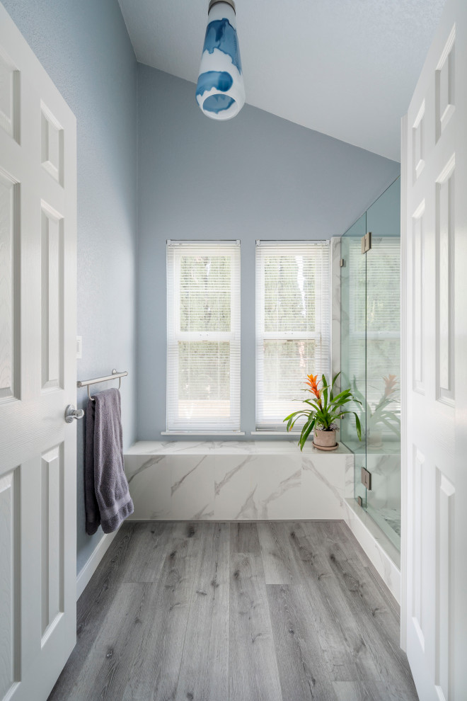 Large trendy master gray tile vinyl floor, gray floor, single-sink and vaulted ceiling bathroom photo in Los Angeles with shaker cabinets, white cabinets, a one-piece toilet, gray walls, an undermount sink, quartz countertops, a hinged shower door, white countertops and a built-in vanity
