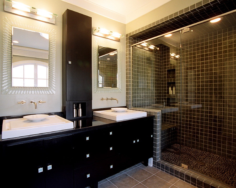 Large contemporary master bathroom in Other with furniture-like cabinets, black cabinets, wood benchtops, a vessel sink, a double shower, beige walls, ceramic floors, gray tile and stone tile.