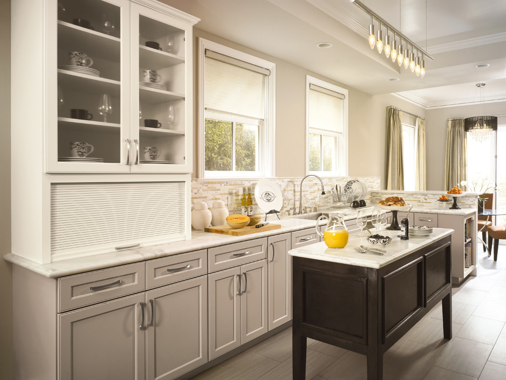 Inspiration for a small transitional l-shaped porcelain tile eat-in kitchen remodel in Toronto with an undermount sink, recessed-panel cabinets, gray cabinets, marble countertops, multicolored backsplash, matchstick tile backsplash and an island