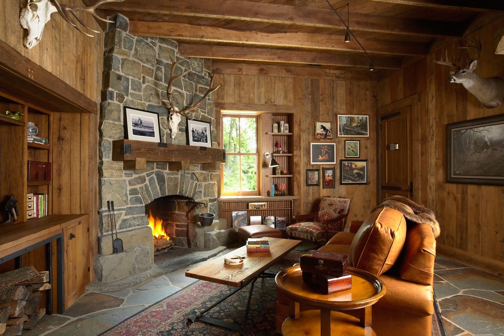 Photo of a country living room in Minneapolis with a corner fireplace and a stone fireplace surround.