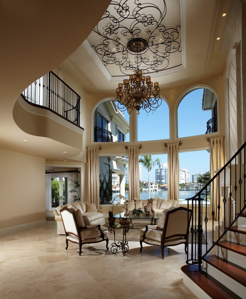 Mediterranean living room in Miami with travertine floors.