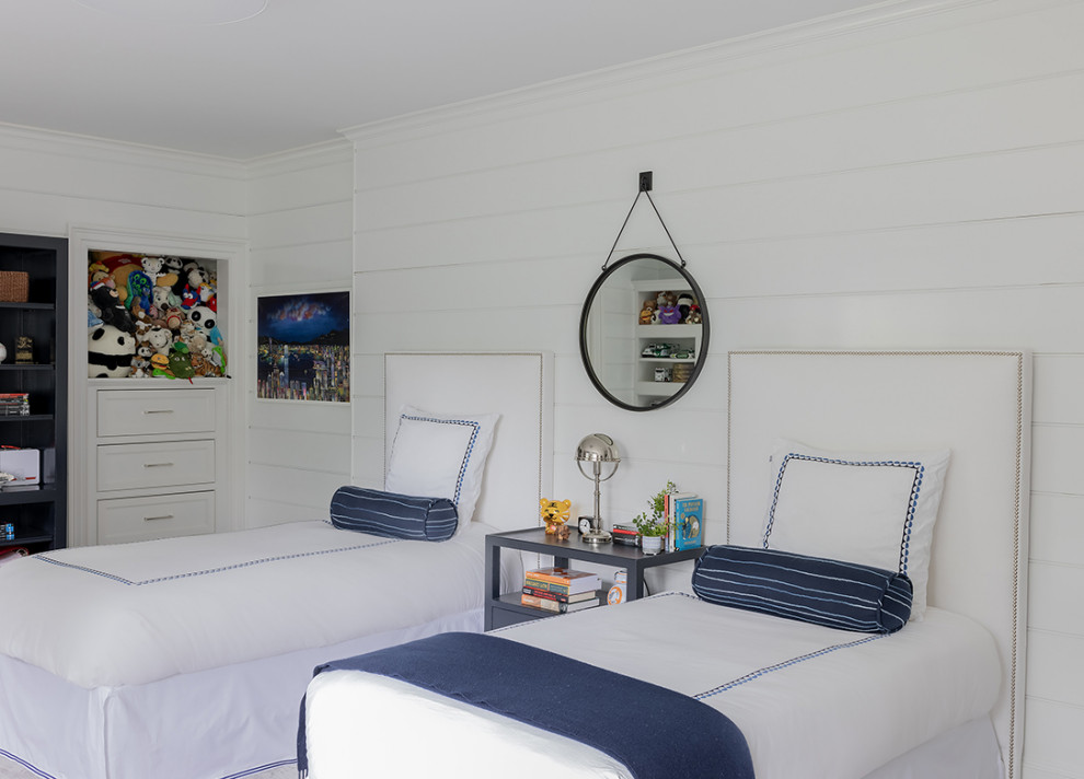 This is an example of a traditional children’s room for boys in Boston with white walls and tongue and groove walls.