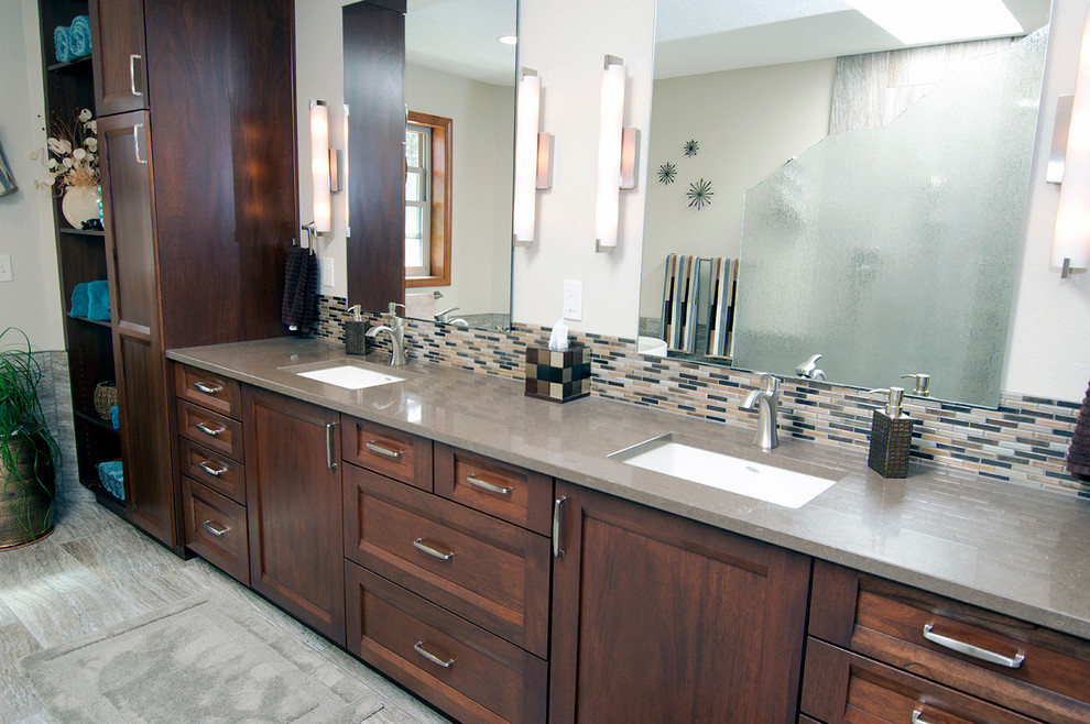 Inspiration for a large rustic master brown tile and porcelain tile porcelain tile freestanding bathtub remodel in Seattle with shaker cabinets, dark wood cabinets, a one-piece toilet, beige walls, an undermount sink and quartz countertops