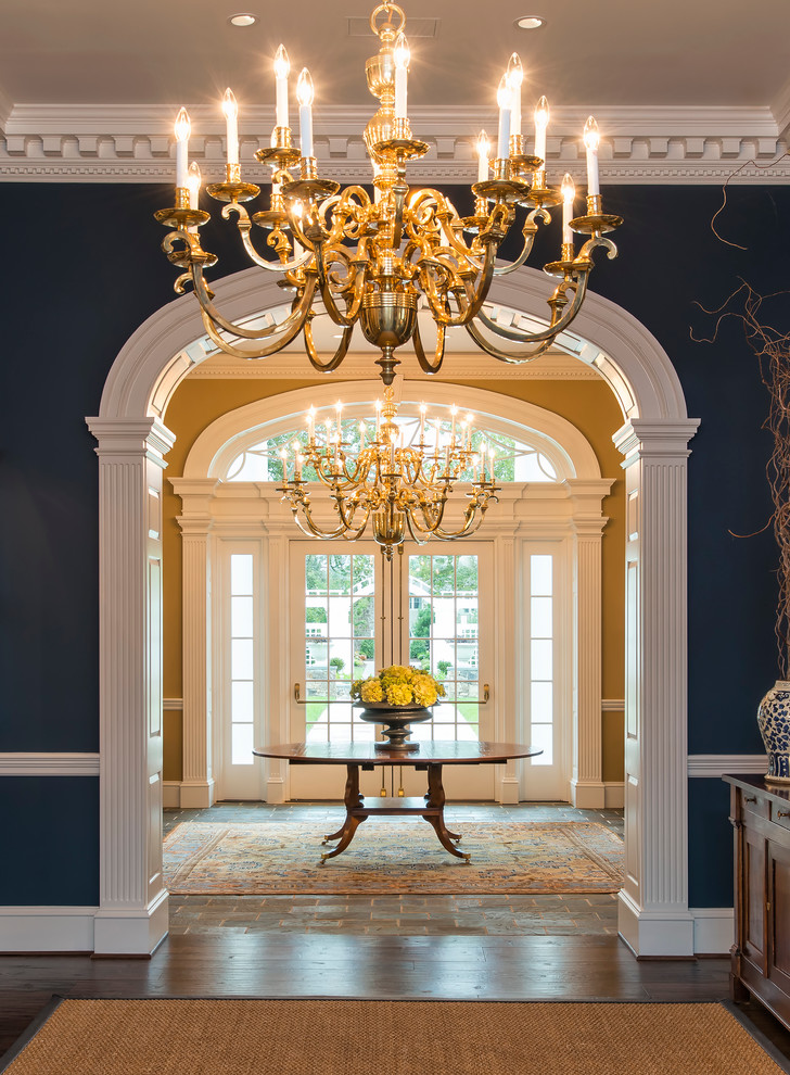 Design ideas for a traditional foyer in DC Metro with blue walls and a double front door.