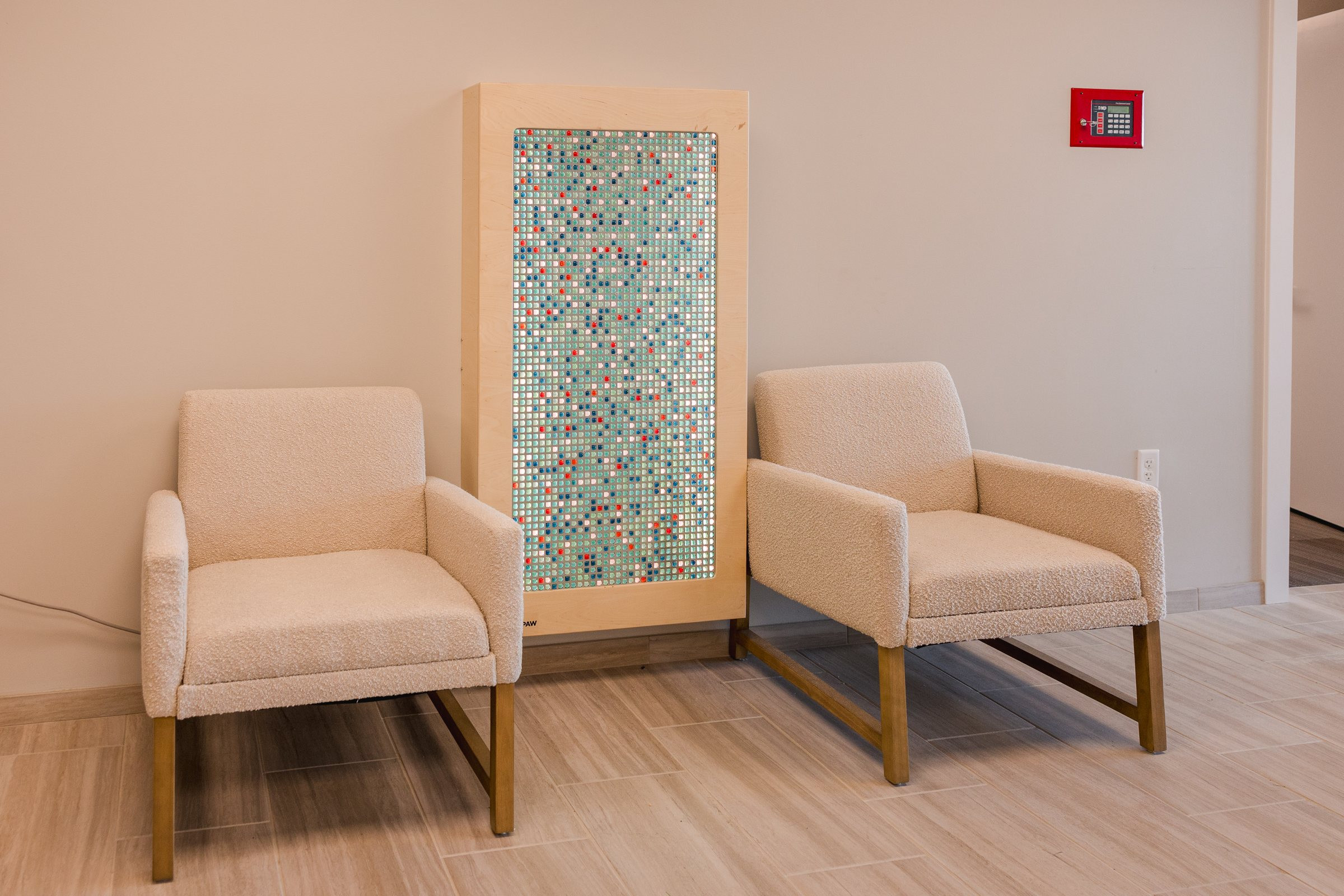 Entry seating with bubble sensory panel, Galliant Autism Center Omaha