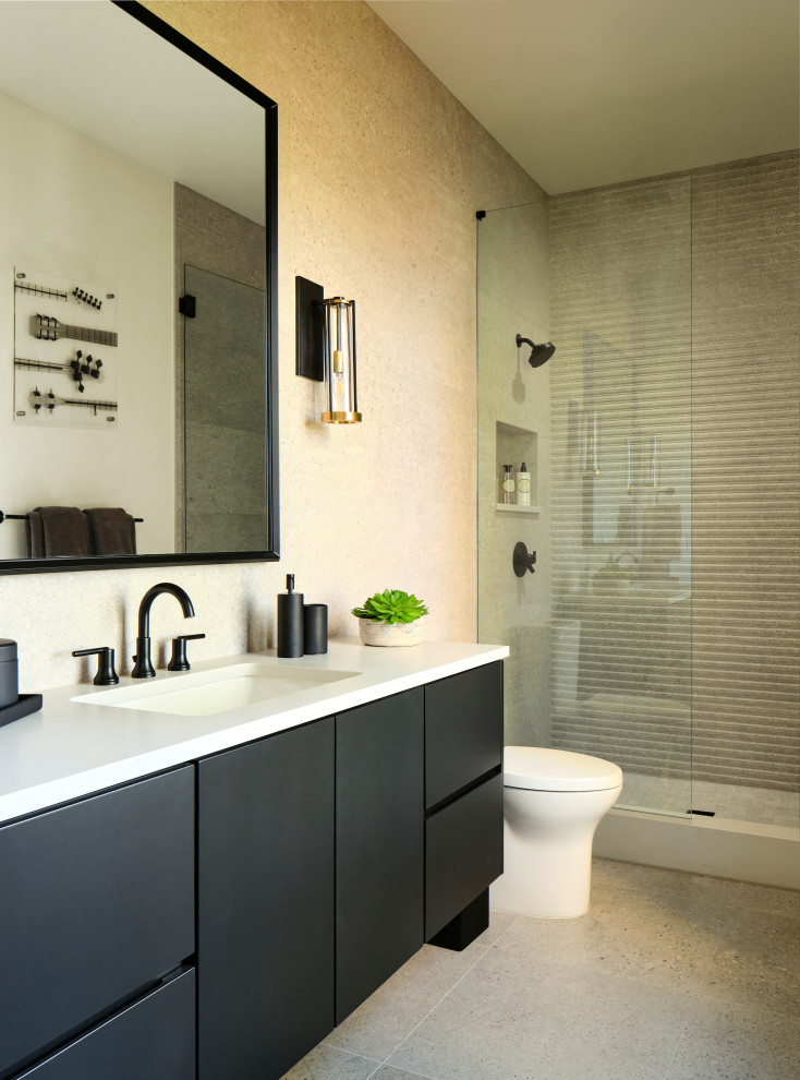 Inspiration for a mid-sized contemporary 3/4 bathroom in Denver with flat-panel cabinets, black cabinets, an open shower, a one-piece toilet, gray tile, limestone, grey walls, limestone floors, an undermount sink, engineered quartz benchtops, grey floor, a hinged shower door, white benchtops, a niche, a single vanity and a floating vanity.