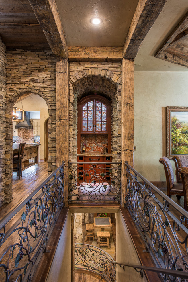 Inspiration for a mid-sized rustic wooden straight metal railing staircase remodel with wooden risers
