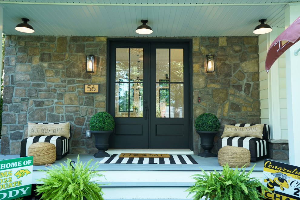 Covered Front Porch with Stone Facade & Black French Doors – Home Addition in Fl