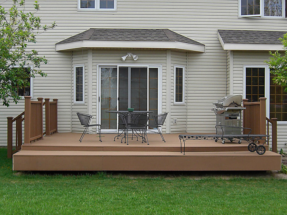 Inspiration for a mid-sized backyard deck remodel with no cover