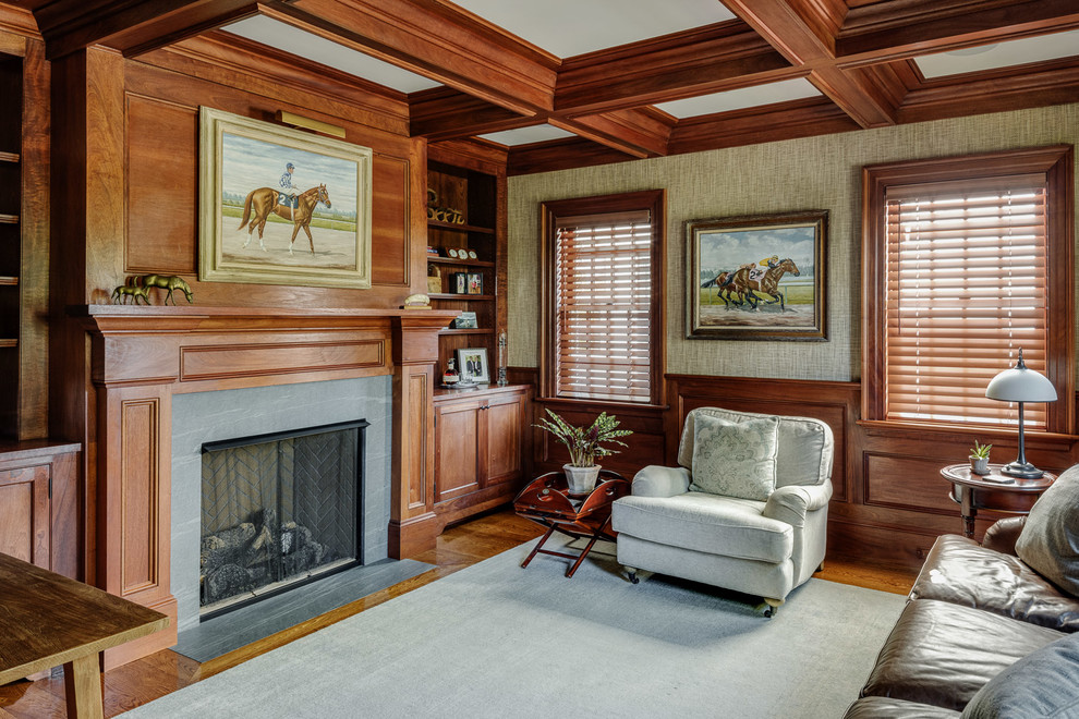 Mid-sized traditional study room in Boston with medium hardwood floors, a standard fireplace and a stone fireplace surround.