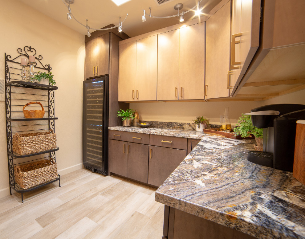 This is an example of an expansive traditional l-shaped utility room in Phoenix with flat-panel cabinets, medium wood cabinets, granite benchtops, porcelain floors and multi-coloured benchtop.