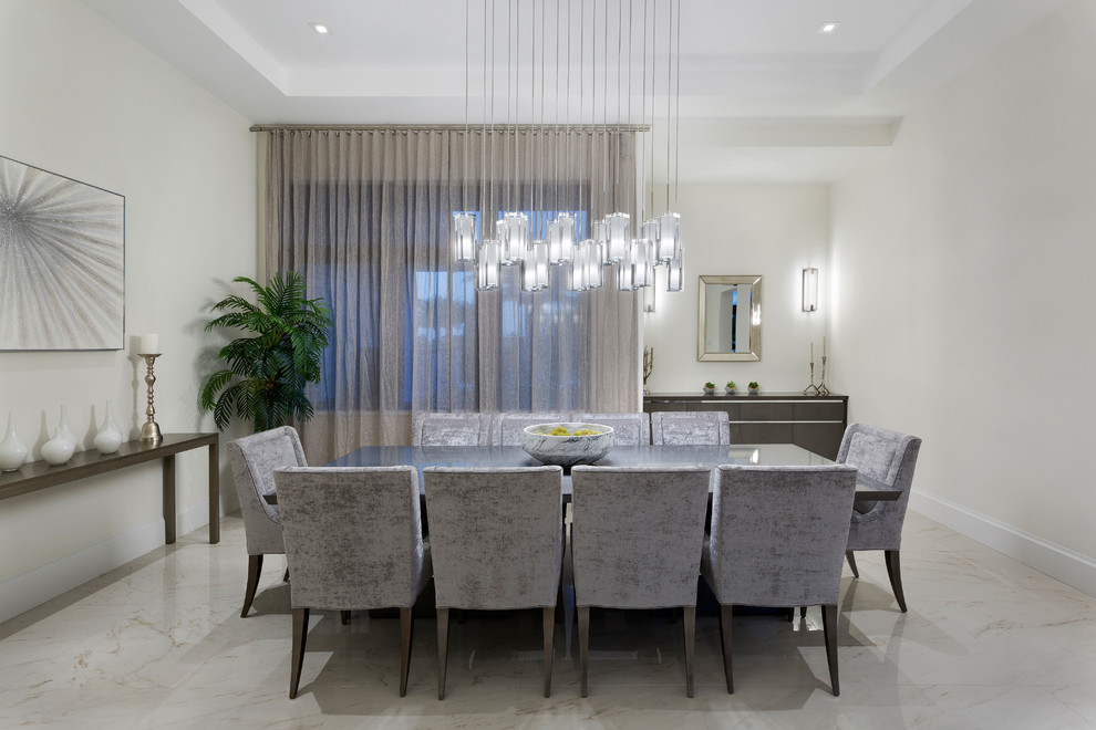 This is an example of a large modern kitchen/dining combo in Miami with beige walls, porcelain floors and white floor.