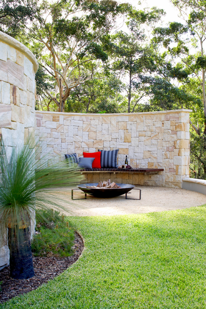 This is an example of a contemporary backyard patio in Sydney with a fire feature.