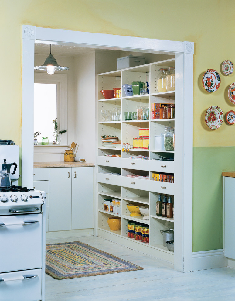 Country kitchen pantry in Baltimore with open cabinets, white cabinets and white appliances.
