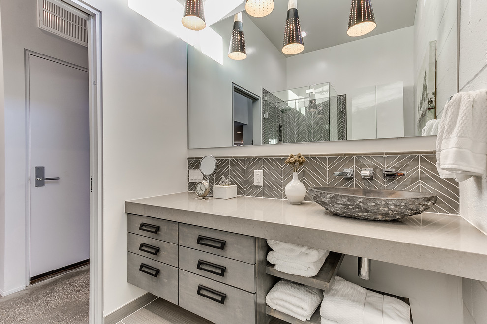 Photo of a large contemporary 3/4 bathroom in Oklahoma City with flat-panel cabinets, grey cabinets, white walls, a vessel sink, gray tile, a corner shower, ceramic tile, vinyl floors, quartzite benchtops, grey floor and a hinged shower door.