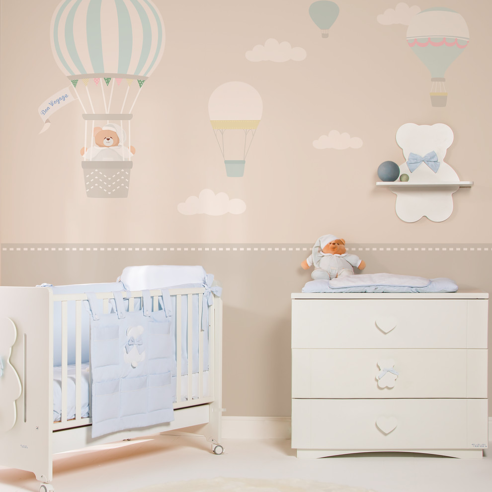 This is an example of a modern gender neutral nursery in Milan with wallpapered walls.