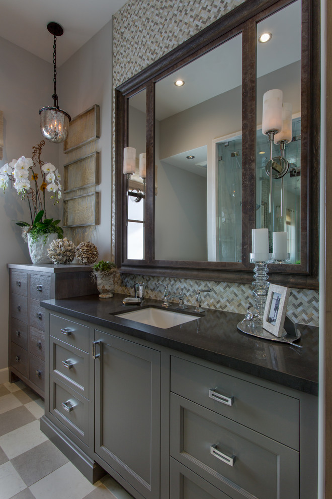 Large transitional master bathroom in Orange County with engineered quartz benchtops, shaker cabinets, grey cabinets, an alcove shower, a two-piece toilet, gray tile, white tile, mosaic tile, grey walls, ceramic floors, an undermount sink, grey floor and a hinged shower door.