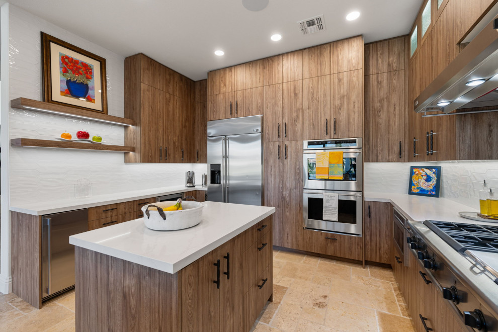 Inspiration for a rustic l-shaped slate floor and beige floor enclosed kitchen remodel with a single-bowl sink, flat-panel cabinets, medium tone wood cabinets, quartzite countertops, white backsplash, glass sheet backsplash, stainless steel appliances, a peninsula and white countertops
