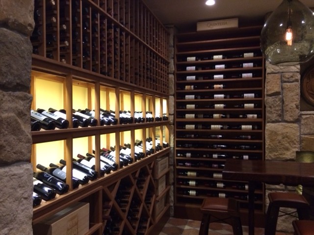 Large country wine cellar in New York with display racks.