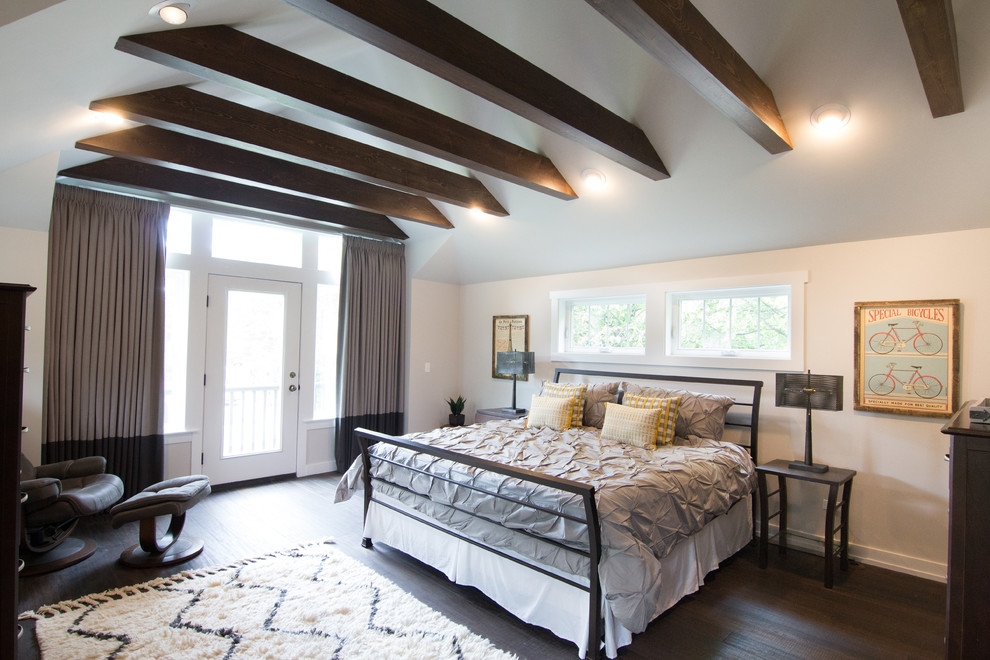 Design ideas for a mid-sized transitional master bedroom in Chicago with white walls and bamboo floors.