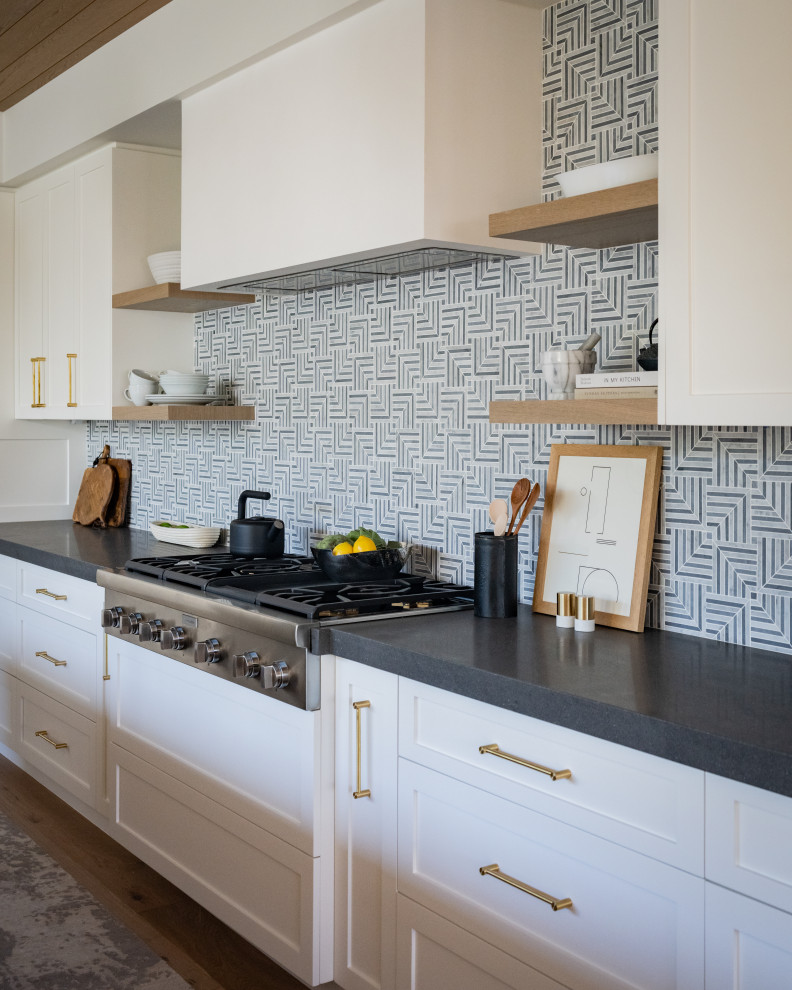 Inspiration for a huge transitional light wood floor kitchen remodel in Orange County with an undermount sink, quartzite countertops, mosaic tile backsplash and an island