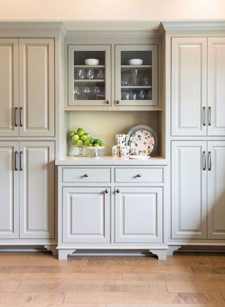 Inspiration for a medium tone wood floor kitchen remodel with raised-panel cabinets, gray cabinets and quartz countertops