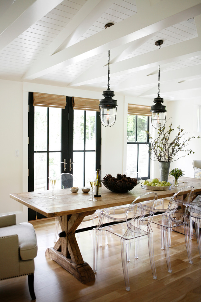 This is an example of a country dining room in Seattle with white walls.