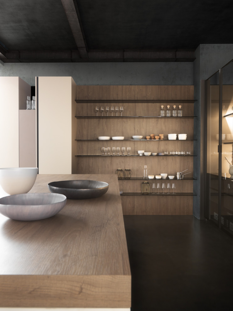 Immagine di una grande cucina minimalista con lavello sottopiano, ante lisce, ante beige, top in legno, pavimento in cemento e pavimento grigio