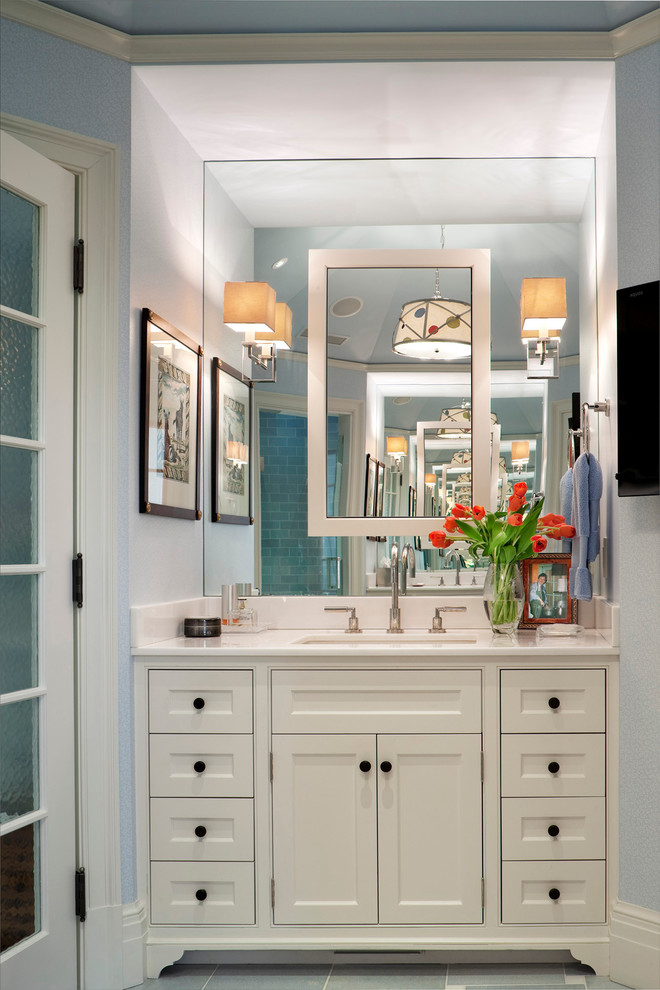 Mid-sized traditional master bathroom in New York with white cabinets, blue walls and recessed-panel cabinets.