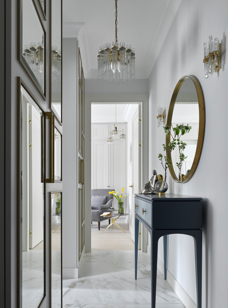 Photo of a small contemporary hallway in Moscow with white walls, porcelain floors and white floor.