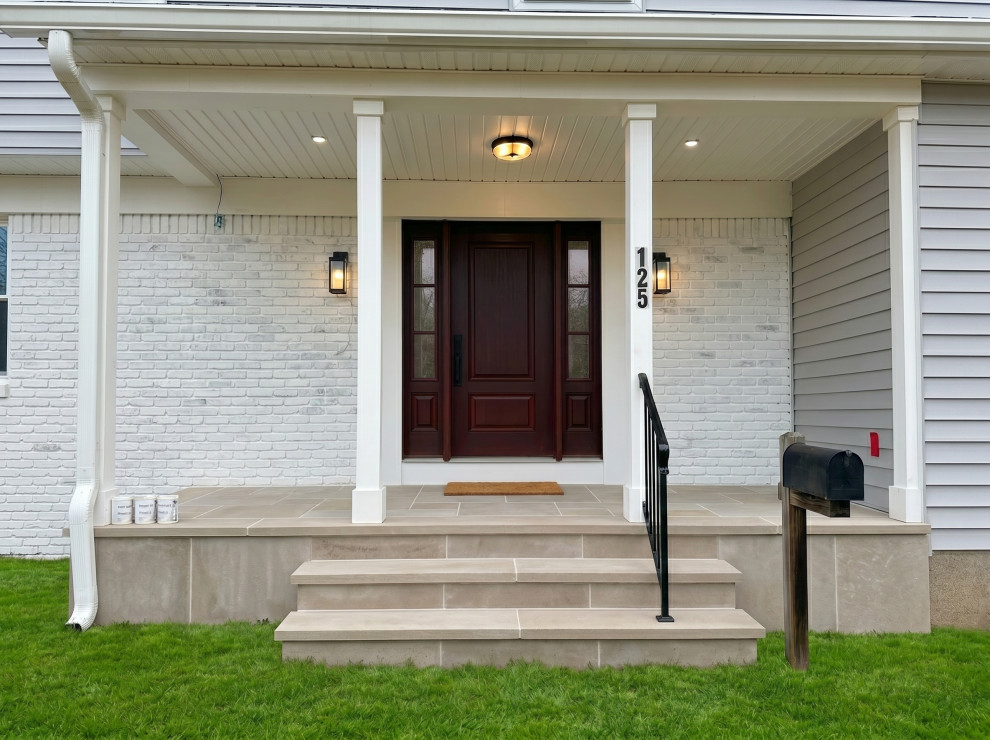Columned Covered Entry with Dark Door