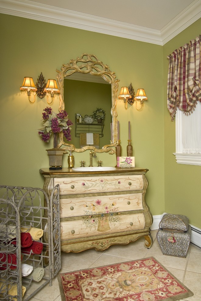 This is an example of a traditional powder room in Newark with a drop-in sink, furniture-like cabinets and beige cabinets.