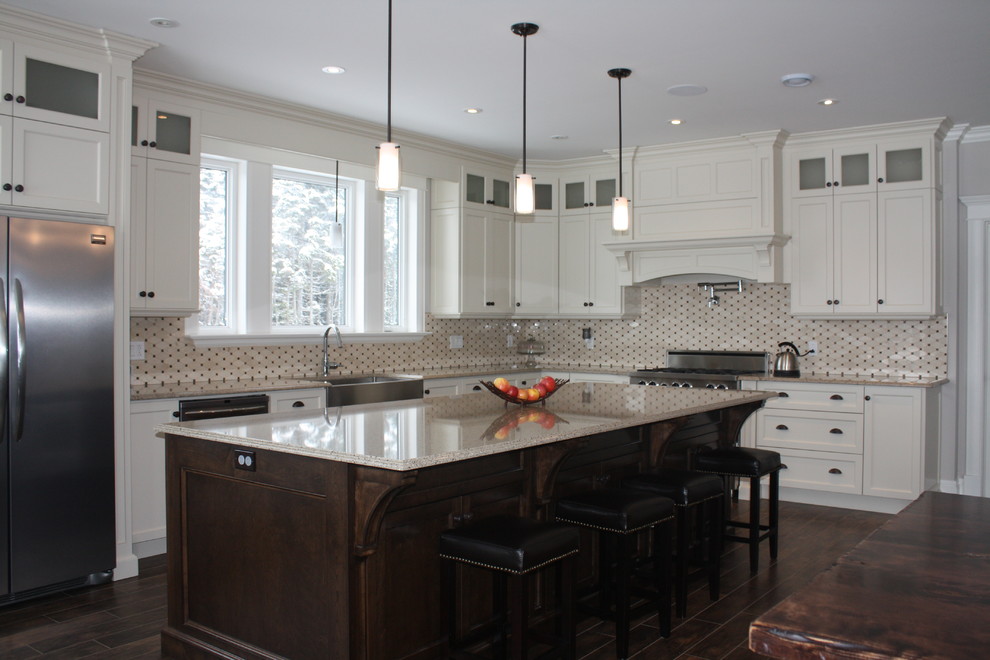 Large elegant l-shaped medium tone wood floor eat-in kitchen photo with an island, recessed-panel cabinets, yellow cabinets, quartz countertops, black backsplash, cement tile backsplash, stainless steel appliances and a farmhouse sink