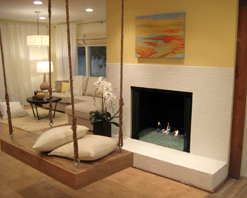 Design ideas for a large transitional open concept family room in Los Angeles with yellow walls, cork floors, a standard fireplace and a tile fireplace surround.