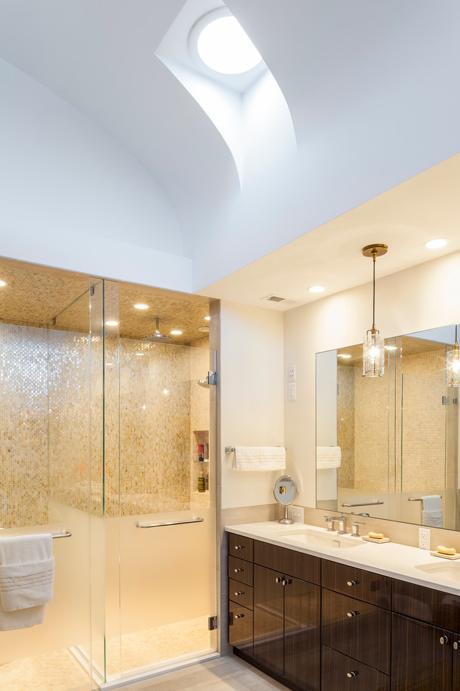 Inspiration for a contemporary master bathroom in Baltimore with flat-panel cabinets, dark wood cabinets, mosaic tile, white walls, an undermount sink, a hinged shower door, porcelain floors and beige floor.