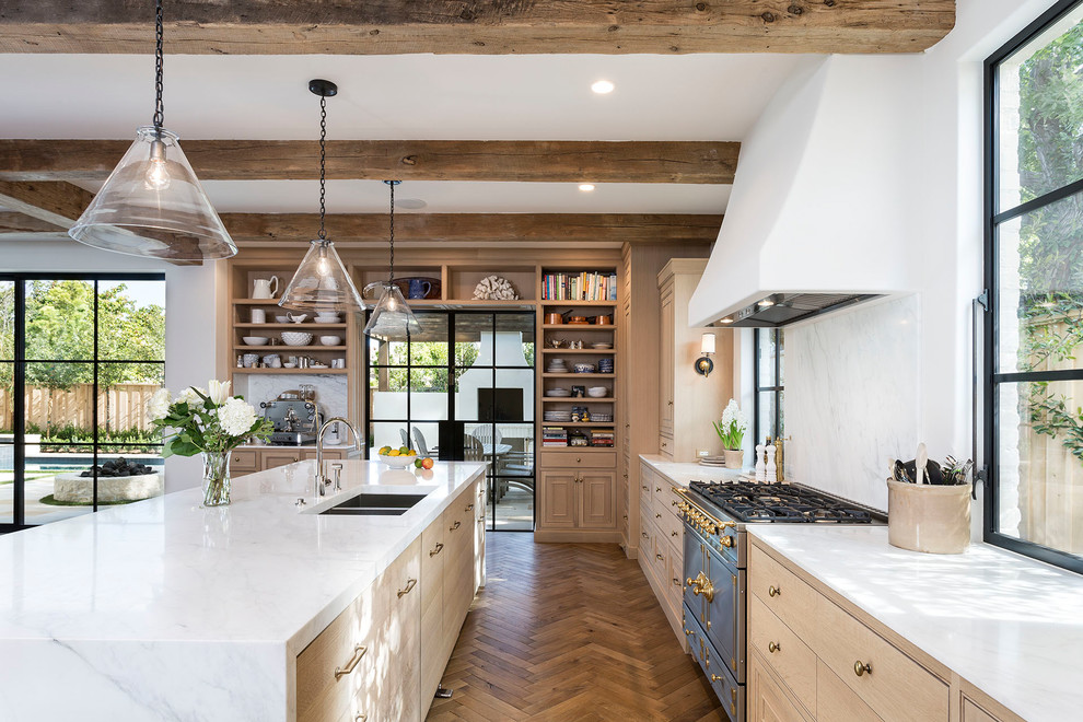 Inspiration for a transitional kitchen in Boise with a double-bowl sink, light wood cabinets, white splashback, medium hardwood floors, with island and brown floor.