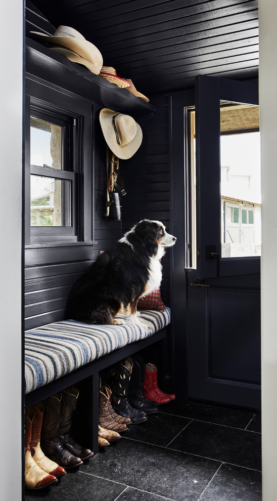 Mudroom - country black floor mudroom idea in Dallas with black walls and a black front door