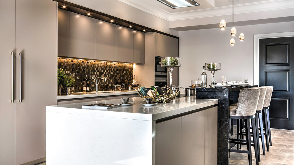 Mid-sized contemporary single-wall kitchen in Other with an undermount sink, flat-panel cabinets, multi-coloured splashback, mosaic tile splashback, a peninsula and grey floor.